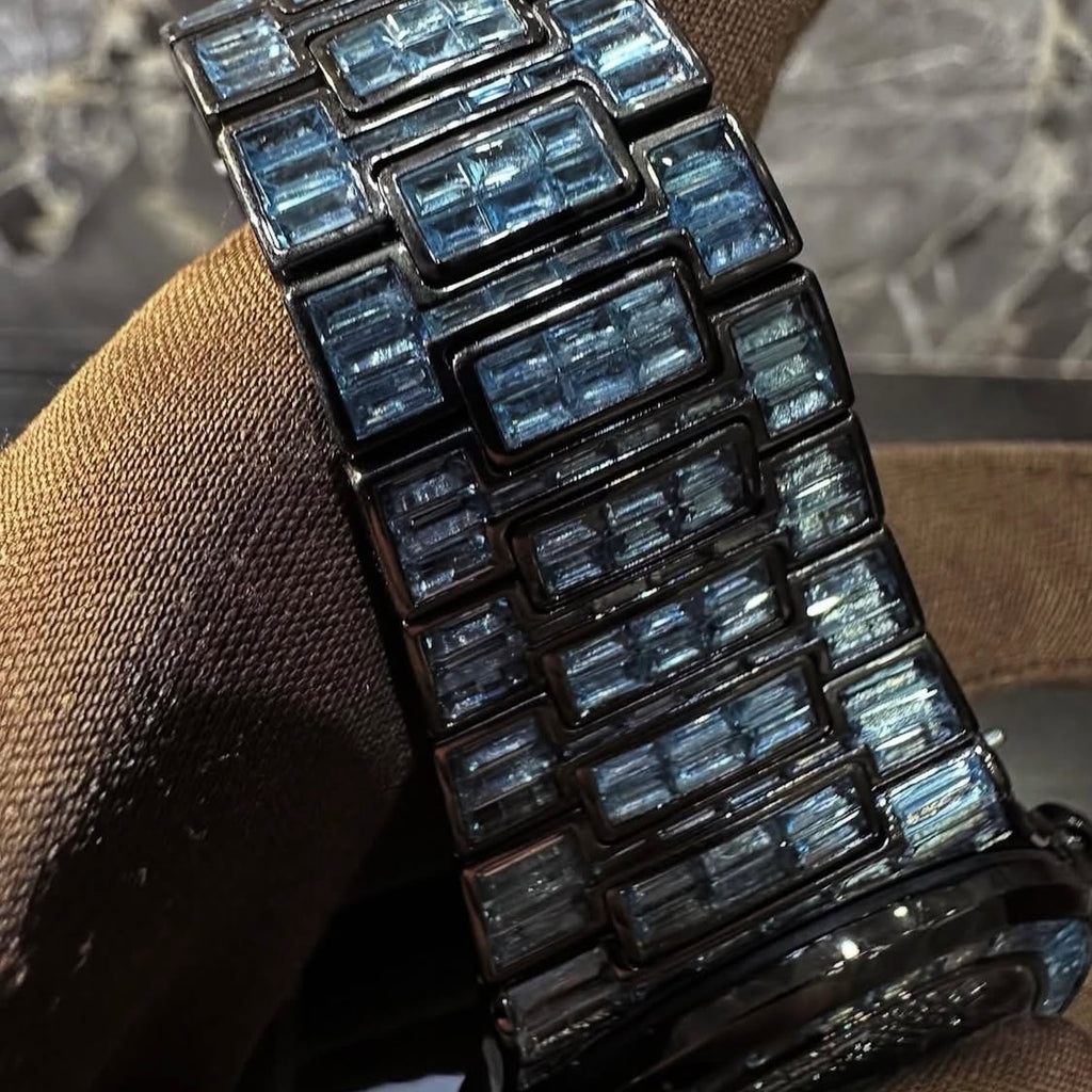 BUSSDOWN PATEK PHILLIPE GENEVE NAUTILUS W/ BLUE BAGUETTE CUT SAPPIRE STONES